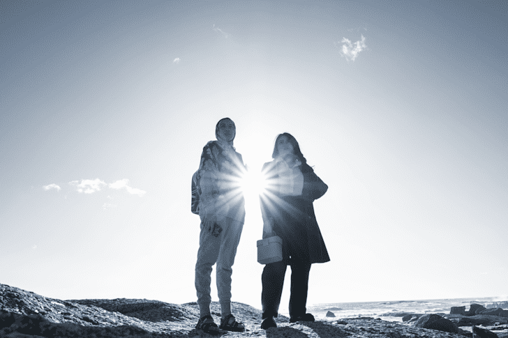 Photo of two Rise Winners on a mountain in South Africa